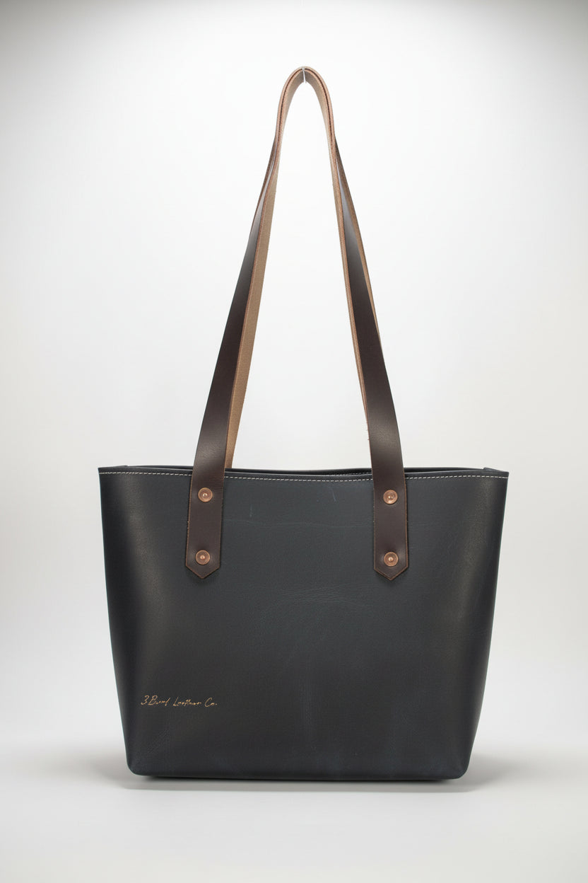 Navy leather tote bag with brown leather straps